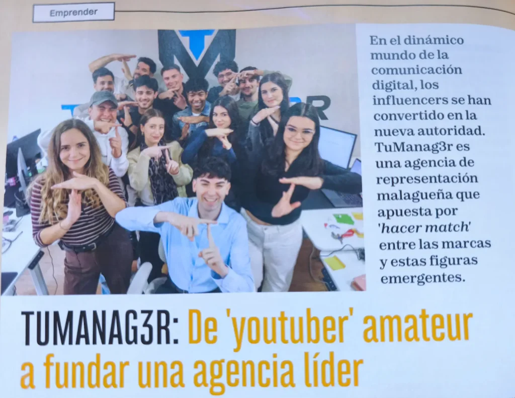 Press clipping featuring a TuManag3r group photograph in the office
